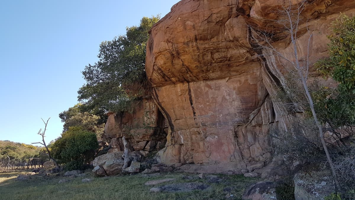 The red sandstone cliff at the Manyana rock painting site