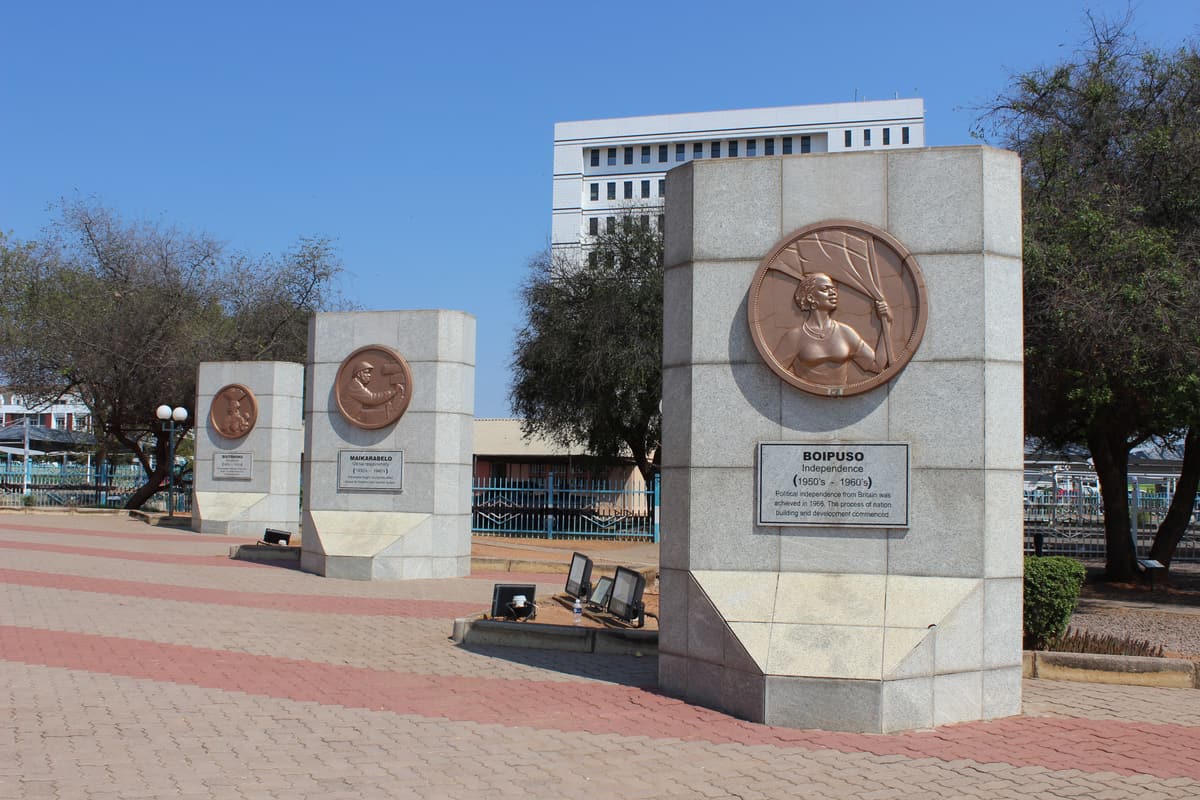 Granite plinths with bronze medallions at the Three Dikgosi Monument